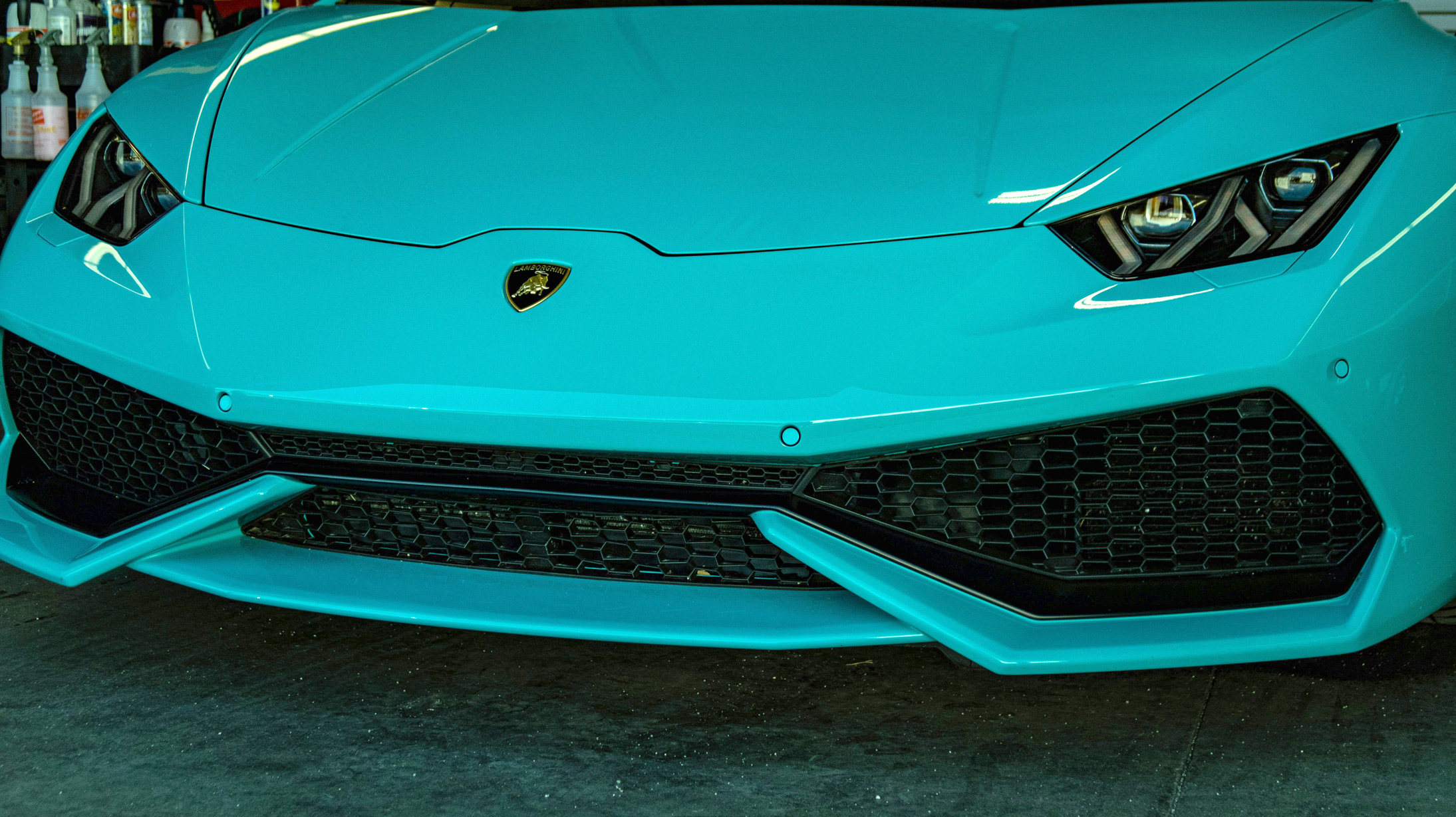 Sports car with Xpel paint protection film professionally installed.